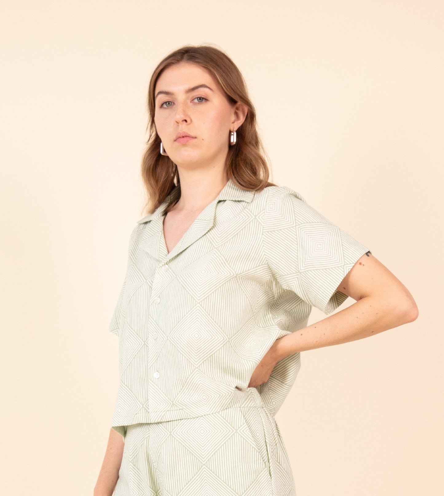 Radiate Rin Top Pale Green | Harkoi Studio - Embrace effortless elegance with the Radiate Rin Top in pale green. Keywords: sustainable top, eco-friendly fashion, Radiate Rin Top, pale green blouse, ethical clothing.