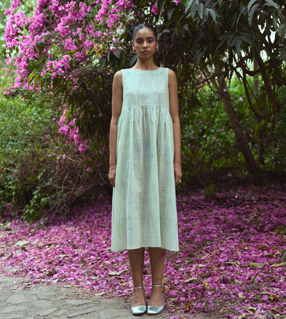 Sleeveless khadi cotton midi dress with sketchy check embroidery and hand-stitched motif, handcrafted in India.