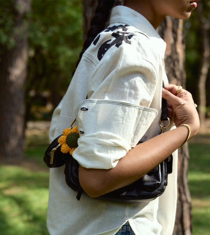 Full-sleeve kala cotton shirt with hand-stitched appliqué patterns and corozo buttons, relaxed fit.